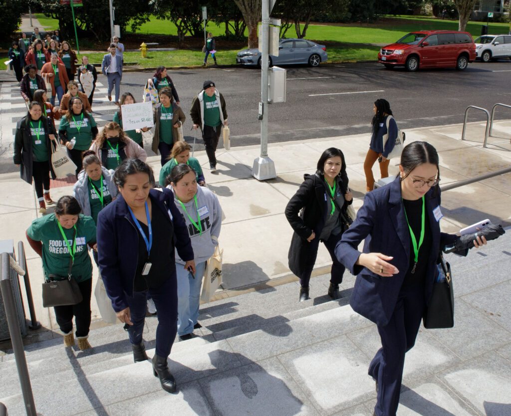 Supporters of Food for All Oregonians bill walk up the steps of the Oregon Capital for advocacy day 2023